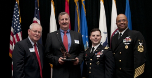  The Ohio Committee for Employer Support of the Guard and Reserve has honored The Goodyear Tire & Rubber Company with the Pro Patria Award. Shown with the award (from left) are: Retired Air Force Brig. Gen. Stephen Koper; Mark Purtilar, vice president and Chief Procurement Officer of The Goodyear Tire & Rubber Company; Veteran and Supplier Qualification Project Leader Jose Rivera; and Force Master Chief C.J. Mitchell, U.S. Navy Reserve.