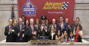 PHOTO: Executives and guests of Virginia-based Advance Auto Parts Inc. (NYSE:AAP) visit the NYSE to highlight their CEO being recognized as Honoree of the Year by Building Homes for Heroes (BHH).  To mark the occasion President George Sherman, along with US Army Sergeant, Hugo Gonzalez, rang the Closing Bell. Photo Credit: NYSE/Valerie Caviness