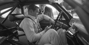 Buddy Baker talks with car owner Ray Fox while sitting in his 1967 Dodge at The Daytona 500 on Feb. 24, 1967, at the Daytona International Speedway. Baker finished fourth. (Photo credit: Dozier Mobley/Getty Images) 