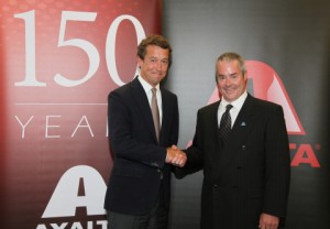 Geoff Piceu, CEO of United Paint (left), and David Grimes, Axalta vice president, Global Automotive Plastic Components, announce Axalta’s acquisition of the automotive interior rigid thermoplastics coatings business of Michigan-based United Paint and Chemical Corp. (Photo credit: Axalta)