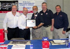Auto 7 President Steven Kruss presents the company’s 2012 Distributor of the Year Award to XL Parts President Ali Attayi and Vice President Supply Chain Mike Thompson at XL Parts’ annual Customer Open House held April 7, 2013 in Houston, Texas. Kruss commended XL Parts for promoting awareness of Auto 7’s OEM quality parts for Hyundai, Kia and GM-Daewoo, as well as providing excellent customer service to installers. Joining Kruss in presenting the award is Auto 7 Senior Vice President Jim Murphey, far left, and Business Development Manager Joe Sotolongo, far right.