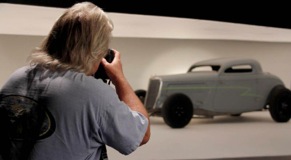 Photographer in the new SEMA Photo Cove with Billy Gibbons' project vehicle.