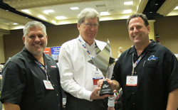centric president dan lelchuk (right) and vp sales michael musso (left) accept the branded supplier of the year award from apa member gene bochinski (center) of g&h import auto parts.