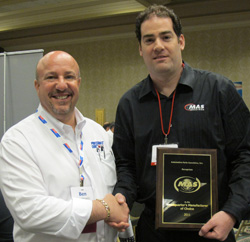 mas industries president mark stermer (right) accepts the headquarters manufacturer of choice award from apa member ben yelowitz (left) of poja warehouse.