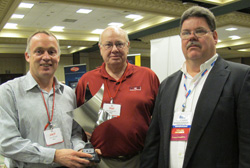 power train components president, jack nihart (left) and hal hultgren (center), national sales manager, accept the professionals’ choice vendor of the year award from apa member robert joshlin (right) of speedway auto parts.