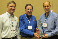 bosch zone manager, joe bergsieker (left) and tim bruin (right), director of sales pdg/traditional channel, accept the marketing partner award from apa president and ceo dan freeman (center).