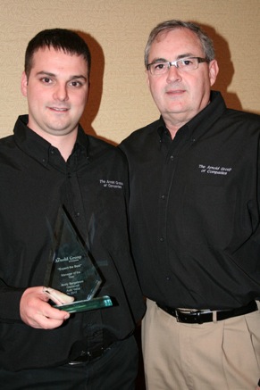 L to R: Andy Bergstrom, manager of the Auto Value Parts Store in Glenwood, Iowa,  and Dennis Spooner, managing partner and president of The Arnold Group.