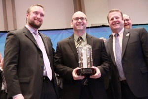Gordon Erdelean (center) receives his Employee of the Year award from Paul Whittleston (left) and Chris Toomey, senior vice president, Coatings Solutions North America.