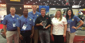 Members of the BASF Automotive Refinish team accepting the Top Custom Car Award with Chip Foose. 