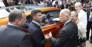 Governor Brown views Chevy BOLT concept car at DRIVE THE DREAM 2015. Photo credit: Claudia Wong.