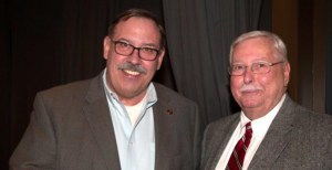 Allan Pavlick (left), vice president of Stertil ALM, congratulated by Streator Mayor Jimmy Lansford (right). 