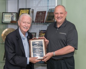 Accepting the award are Tracer Products' Gary Testa (right), featured with Spectronics' Founder and Chairman Bill Cooper (left).