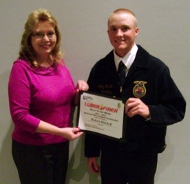 (Left) Kay Mundy, HR generalist with Champion Laboratories, presents the Luber-finer National FFA Scholarship award to Henry Mitchell of York, S.C. 