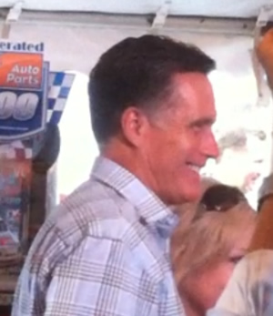 Republican presidential candidate Mitt Romney greets hundreds of NASCAR fans inside an infield tent prior to Saturday's race.