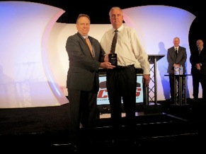 BodyShop Business Publisher S. Scott Shriber (left) presents Middleton with his award.