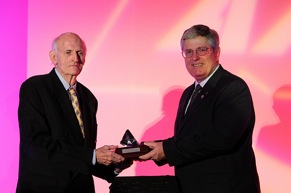 Glasgow accepts his award from MEMA CEO Bob McKenna.