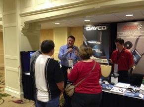  Doug Adams of Dayco Products explains the company's new VIN app on the trade show floor.