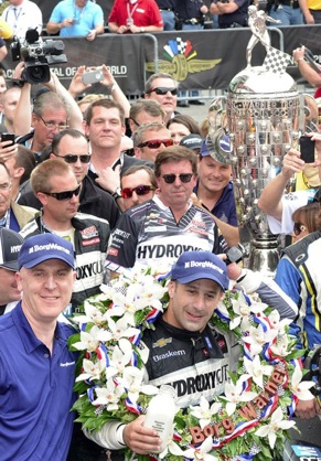 Standing beside the Borg-Warner Trophy in Victory Lane, BorgWarner President and Chief Executive Officer James Verrier congratulated Tony Kanaan on his victory at the Indianapolis 500. (PRNewsFoto/BorgWarner Inc., Photo courtesy of Rob Banayote)