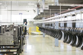 Production - Bendix brake shoes cool down following the application of the advanced coating and the tightly controlled oven curing process that provide maximum protection against rust jacking.