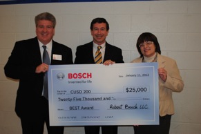 David Coolidge, executive vice president, Americas, Robert Bosch LLC, (center) presented the award to Board of Education President Rosemary Swanson and Superintendent Dr. Brian Harris at a recent school board meeting.